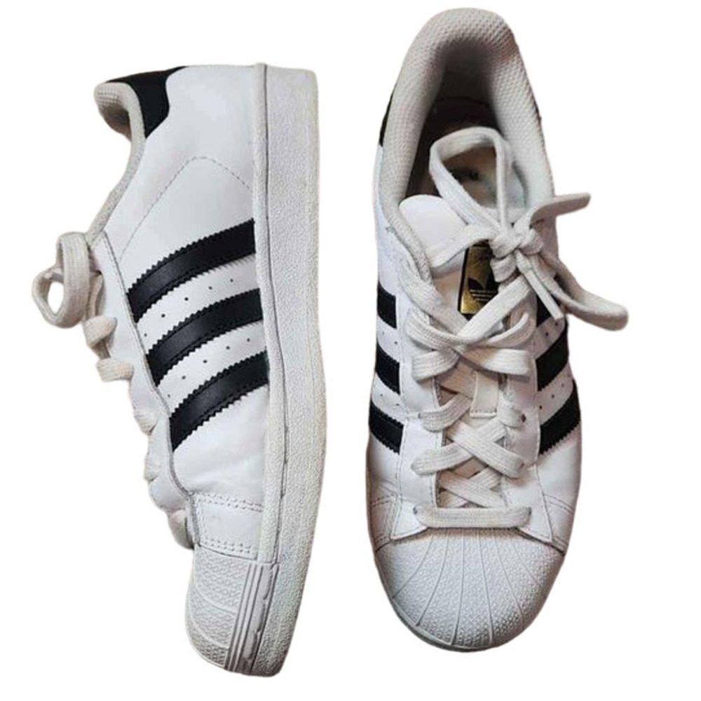 Adidas white low top superstars with black Adidas three stripes 5.5 men 7.5W